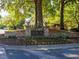 Stone sign for Sugar Mill Recreation Center surrounded by trees and flowerbeds at 365 Falling Creek Bnd, Duluth, GA 30097