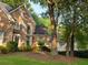 Charming brick home with well-manicured lawn and mature trees at 365 Falling Creek Bnd, Duluth, GA 30097