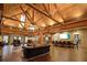 Luxurious space showcasing hardwood floors, wood beam ceiling, and elegant seating at 365 Falling Creek Bnd, Duluth, GA 30097