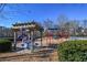 Community playground with picnic tables and climbing structures offers outdoor fun for residents in a great location at 365 Falling Creek Bnd, Duluth, GA 30097
