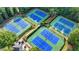 Aerial view of well-maintained tennis courts surrounded by mature trees at 365 Falling Creek Bnd, Duluth, GA 30097