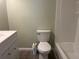 Bathroom features a bright white shower and toilet at 5950 Wintergreen Rd, Norcross, GA 30093