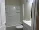 Bathroom with white tub and vanity at 5950 Wintergreen Rd, Norcross, GA 30093
