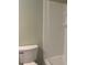 Bathroom features a bright white shower and toilet at 5950 Wintergreen Rd, Norcross, GA 30093