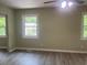 Bedroom with windows and wood-look floors at 5950 Wintergreen Rd, Norcross, GA 30093