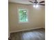 Bedroom with a ceiling fan and window at 5950 Wintergreen Rd, Norcross, GA 30093