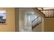 The home features a bright entryway with a staircase and views into the kitchen at 5950 Wintergreen Rd, Norcross, GA 30093