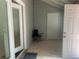 Back entryway featuring tile floors, two doors, and neutral paint at 5950 Wintergreen Rd, Norcross, GA 30093