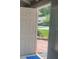 View of a front door with storm door open to brick entrance at 5950 Wintergreen Rd, Norcross, GA 30093