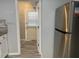 Hallway with stainless refrigerator and access to the rear patio at 5950 Wintergreen Rd, Norcross, GA 30093
