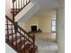 Open living room features a fireplace, wood stairs, and access to the outdoors at 5950 Wintergreen Rd, Norcross, GA 30093