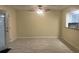 Open living room with ceiling fan and view into the kitchen at 5950 Wintergreen Rd, Norcross, GA 30093