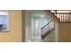 View of the entryway with staircase and open to the kitchen at 5950 Wintergreen Rd, Norcross, GA 30093