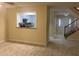 Living room offers an open floor plan with staircase, kitchen view, and hardwood floors at 5950 Wintergreen Rd, Norcross, GA 30093