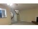 The living room features neutral walls, an adjacent kitchen, and access to the upper level at 5950 Wintergreen Rd, Norcross, GA 30093