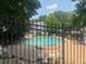 Community pool with seating and landscaping at 5950 Wintergreen Rd, Norcross, GA 30093