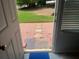 View from an open door featuring a brick walkway leading out to the front yard at 5950 Wintergreen Rd, Norcross, GA 30093