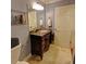 Cozy bathroom with brown granite counters, neutral colored tile, and storage at 36 Saint Claire Ne Ln, Atlanta, GA 30324