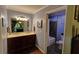 Stylish bathroom features a double vanity, tile floors, and shower-tub combo at 36 Saint Claire Ne Ln, Atlanta, GA 30324