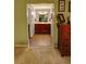 Hallway view of a double vanity bathroom with dark wooden cabinetry at 36 Saint Claire Ne Ln, Atlanta, GA 30324