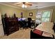 Bedroom featuring carpet, neutral walls, window, and a dark wood wardrobe at 36 Saint Claire Ne Ln, Atlanta, GA 30324