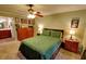 Neutral bedroom offering a ceiling fan and an adjacent door leading to the bathroom at 36 Saint Claire Ne Ln, Atlanta, GA 30324