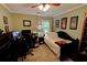 Cozy bedroom featuring a wood ceiling fan, neutral walls, and study and sleeping areas at 36 Saint Claire Ne Ln, Atlanta, GA 30324