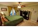 Bedroom features neutral walls, ceiling fan, and a private outdoor balcony at 36 Saint Claire Ne Ln, Atlanta, GA 30324
