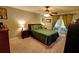 Comfortable bedroom featuring neutral decor, ceiling fan, and access to a private balcony at 36 Saint Claire Ne Ln, Atlanta, GA 30324