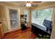 Sunlit breakfast nook with hardwood floors, ceiling fan, and a view of trees at 36 Saint Claire Ne Ln, Atlanta, GA 30324