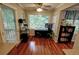 Sunlit breakfast nook with hardwood floors, ceiling fan, and a view of trees at 36 Saint Claire Ne Ln, Atlanta, GA 30324