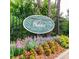 Welcoming Walden on Lenox community sign surrounded by vibrant landscaping and a decorative black fence at 36 Saint Claire Ne Ln, Atlanta, GA 30324