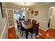 Inviting dining room with hardwood floors, white trim, and a wooden table set for six at 36 Saint Claire Ne Ln, Atlanta, GA 30324