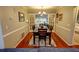 Open dining room featuring hardwood floors, white trim, and a dark wood dining table at 36 Saint Claire Ne Ln, Atlanta, GA 30324