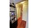 View down hallway with red hardwood flooring and closet to a glimpse of kitchen at 36 Saint Claire Ne Ln, Atlanta, GA 30324