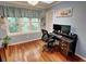Bright home office with hardwood floors, a large window, and a modern desk setup at 36 Saint Claire Ne Ln, Atlanta, GA 30324