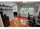Functional office space with hardwood floors, a large window, and a comfortable workspace at 36 Saint Claire Ne Ln, Atlanta, GA 30324