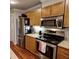 Spacious kitchen with stainless steel appliances, wood cabinets, and granite counters at 36 Saint Claire Ne Ln, Atlanta, GA 30324
