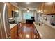Well-lit kitchen with wood cabinets, stainless steel appliances, and an adjacent dining area at 36 Saint Claire Ne Ln, Atlanta, GA 30324
