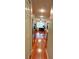 Galley kitchen featuring stainless steel appliances, wooden cabinetry and granite countertops at 36 Saint Claire Ne Ln, Atlanta, GA 30324