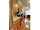 Galley kitchen featuring stainless steel appliances, wooden cabinetry and granite countertops at 36 Saint Claire Ne Ln, Atlanta, GA 30324