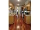 Galley kitchen with stainless steel appliances, wooden cabinetry, and hardwood floors at 36 Saint Claire Ne Ln, Atlanta, GA 30324