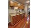 Kitchen with granite countertops, stainless appliances, and hardwood floors at 36 Saint Claire Ne Ln, Atlanta, GA 30324