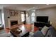 Stylish living room featuring hardwood floors, fireplace, and large TV at 36 Saint Claire Ne Ln, Atlanta, GA 30324