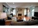Open-concept living room, hardwood floors, and comfortable seating arrangement at 36 Saint Claire Ne Ln, Atlanta, GA 30324