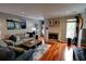 Cozy living room with a fireplace, hardwood floors, and neutral décor at 36 Saint Claire Ne Ln, Atlanta, GA 30324