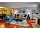Spacious living room with hardwood floors, ample seating, and a cozy fireplace at 36 Saint Claire Ne Ln, Atlanta, GA 30324
