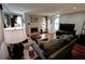 Open living room layout with fireplace, hardwood floors, large windows, and contemporary furniture at 36 Saint Claire Ne Ln, Atlanta, GA 30324