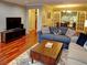 Well-lit living room connecting to the dining area and French doors at 36 Saint Claire Ne Ln, Atlanta, GA 30324