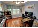 Home office space with ample natural light, dual monitors, and wood floors at 36 Saint Claire Ne Ln, Atlanta, GA 30324